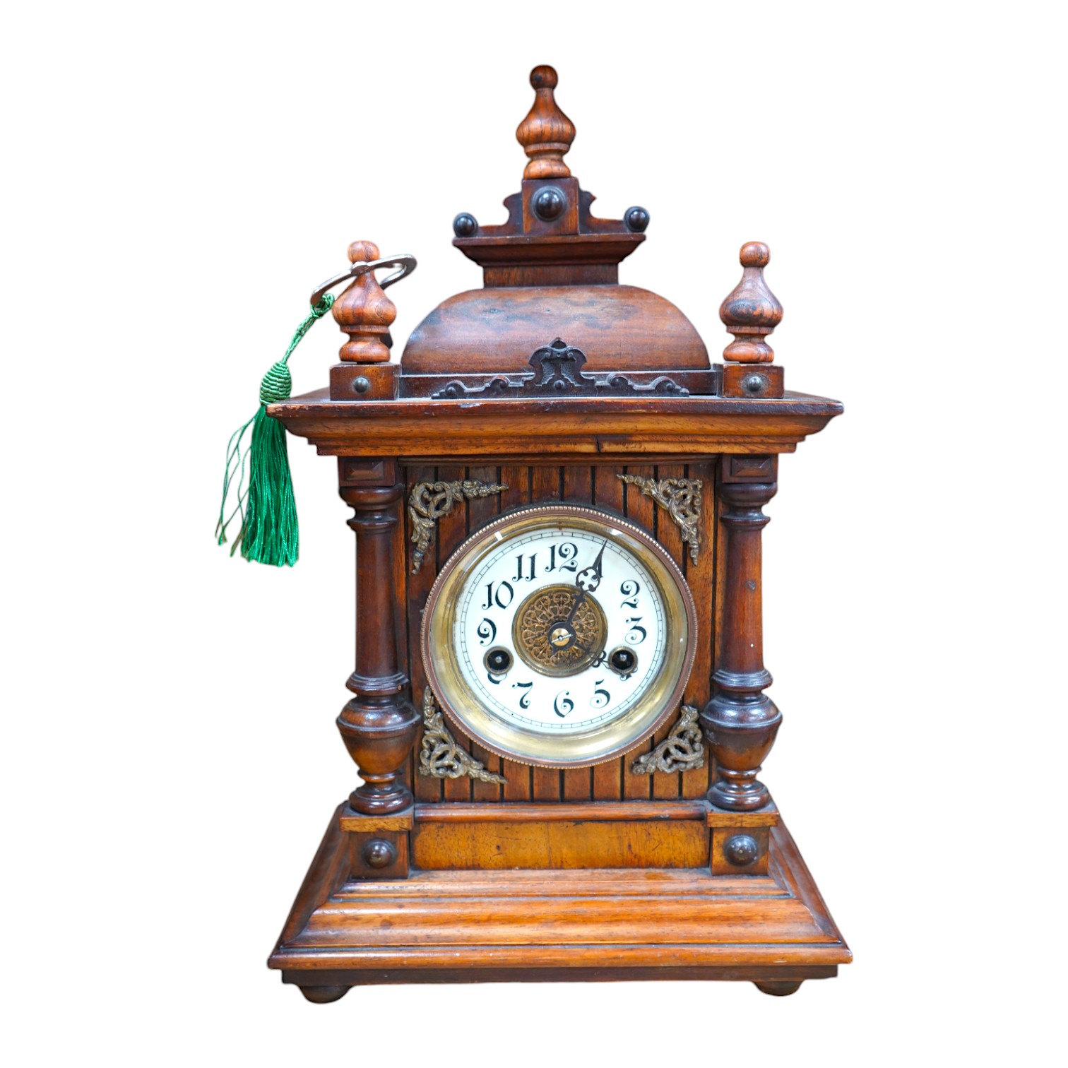 A late 19th century Black Forest walnut mantel clock with key and pendulum, 41cm. Condition - fair to good, not tested